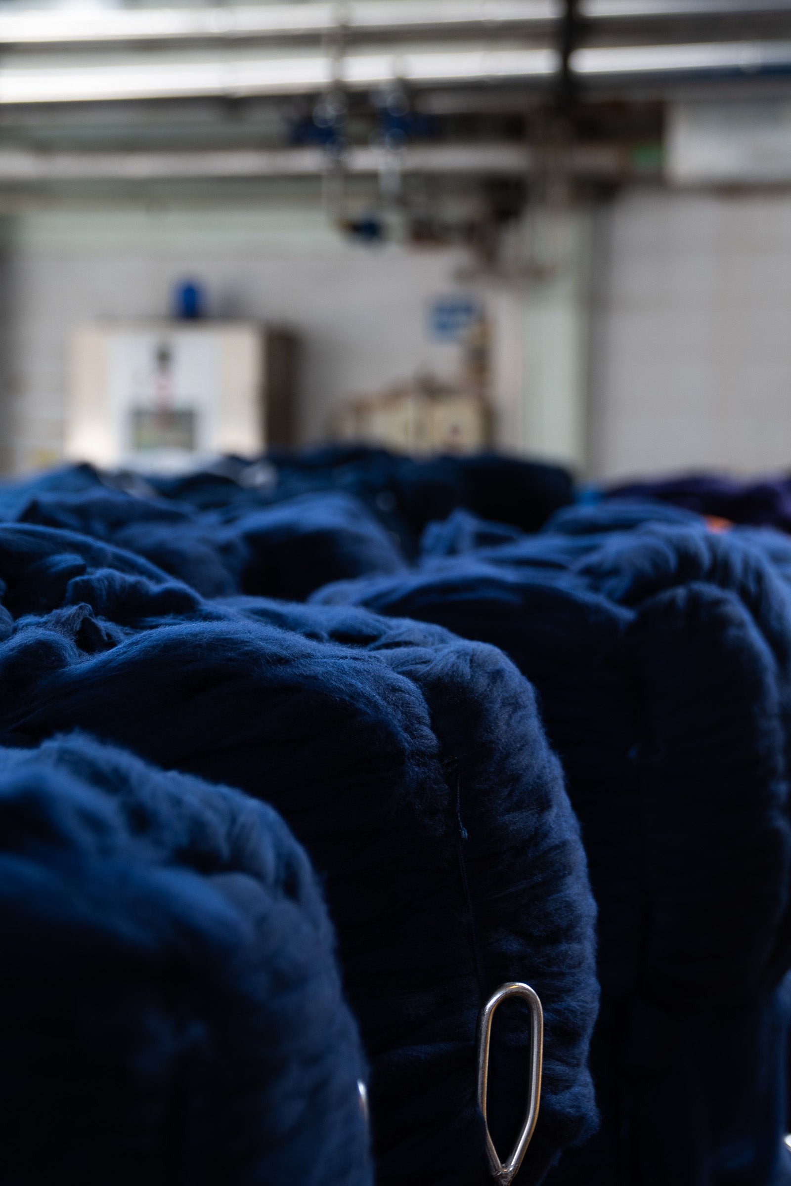 A close up shot of blue dyed Merino wool bumps at the Tintoria Ferraris facility