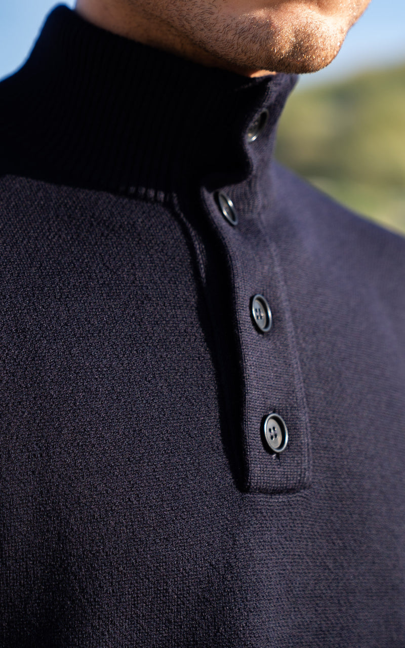 Close-up The Merino Jacquard Button Up in an outdoor dune area