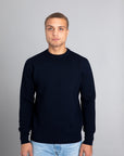 Model wearing The Merino Jacquard 2.0 Navy, Front view - Unborn