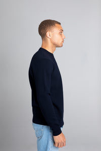 Model wearing The Merino Jacquard 2.0 Navy, right view - Unborn