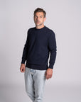 Model wearing Merino Featherweight Sweater Navy Front View