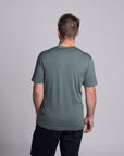 Model wearing Merino Featherweight T-shirt Moss Green Back
