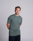 Model wearing Merino Featherweight T-shirt Moss Green Front View
