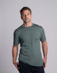 Model wearing Merino Featherweight T-shirt Moss Green Front View