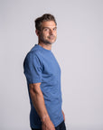 Model wearing Merino Featherweight T-shirt Sky Blue Side View