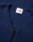 Close up with details of the collar of the UNBORN Merino d'Arles Padded vest in medieval blue
