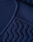 Close up with details of the knit structure of the UNBORN Merino d'Arles Padded vest in medieval blue