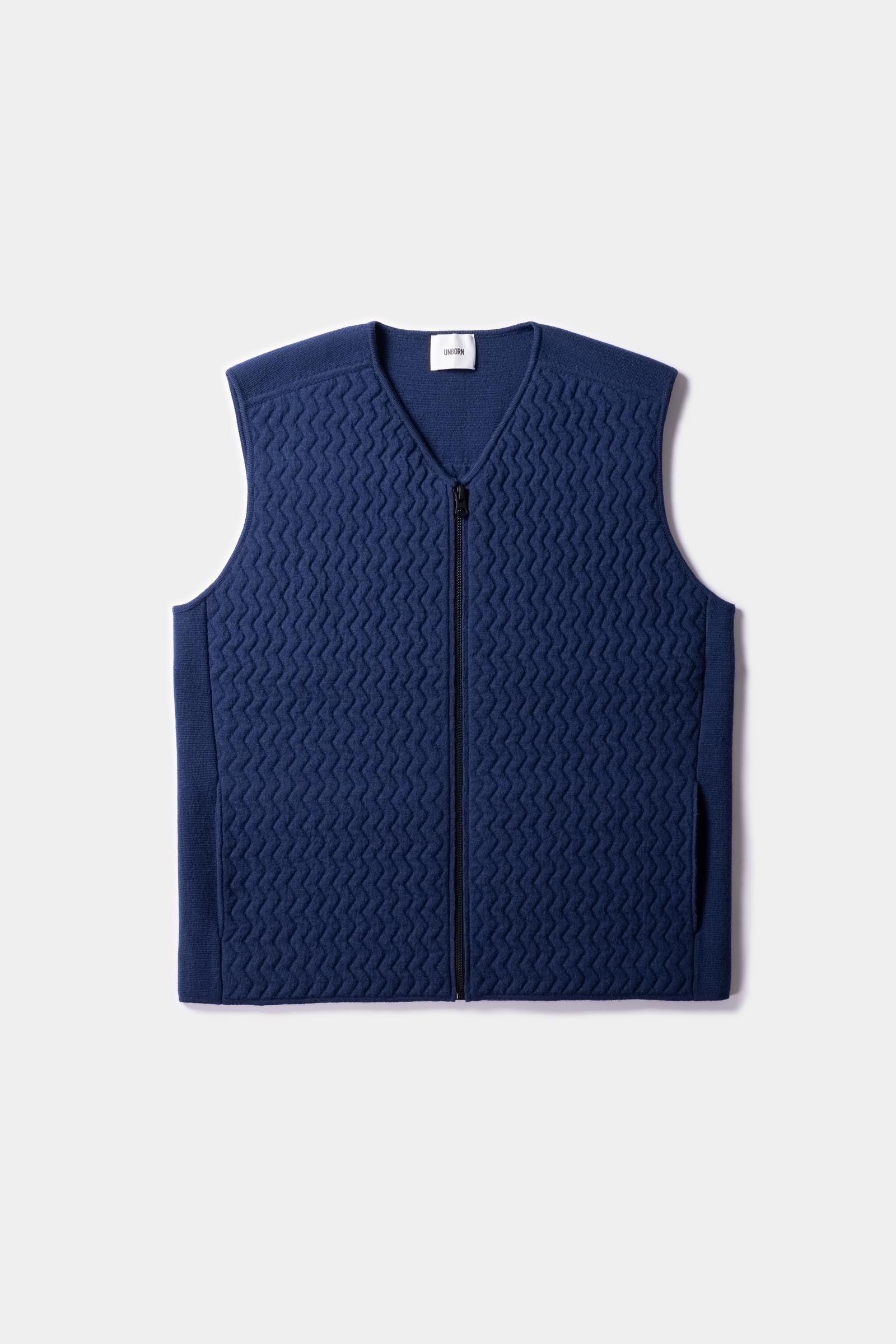 Flatlay of the Merino d&#39;Arles Padded vest in medieval blueFront Unborn