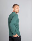 Model wearing The Merino Wool Sweater Light Foggy Green , back - Unborn