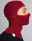 Model wearing The Merino Balaclava Brick Red