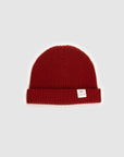 The Merino wool beanie brick red, flat front view Unborn