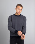 Model Wearing The Merino wool jaquard sweater Navy Grey, front - Unborn