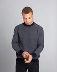 Model Wearing The Merino wool jaquard sweater Navy Grey, front - Unborn