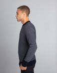 Model Wearing The Merino wool jaquard sweater Navy Grey, left - Unborn