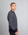 Model Wearing The Merino wool jaquard sweater Navy Grey, right - Unborn