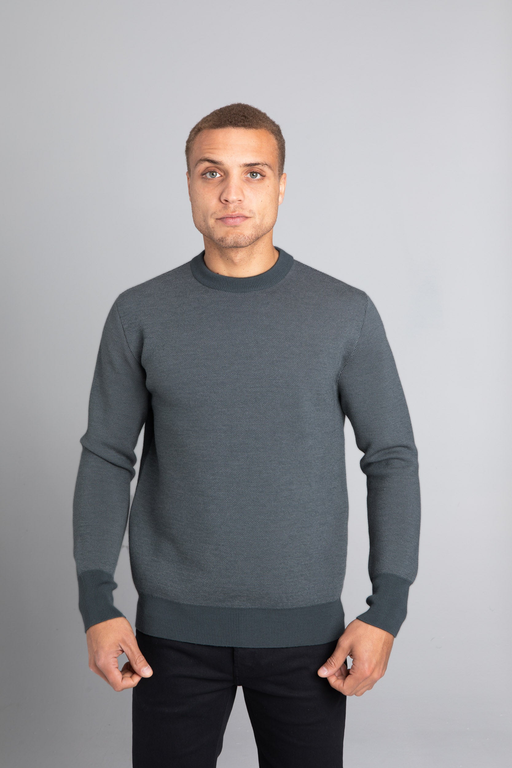 Model Wearing The Merino wool jaquard sweater Navy Grey, front - Unborn