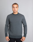 Model Wearing The Merino wool jaquard sweater Navy Grey, front - Unborn