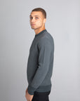 Model Wearing The Merino wool jaquard sweater Navy Grey, left - Unborn