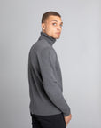 Model Wearing The Merino Wool Roll Neck Grey, back - Unborn