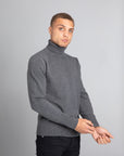 Model Wearing The Merino Wool Roll Neck Grey, front - Unborn