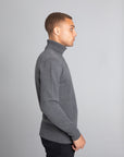 Model Wearing The Merino Wool Roll Neck Grey, right - Unborn