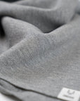 The Merino Wool Square Scarf Grey melange, close up fabric - Unborn