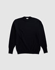 Model wearing The Merino Wool Sweater Black, flat front  - Unborn