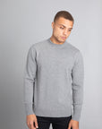 Model wearing The Merino Wool Sweater Grey Melange, front - Unborn