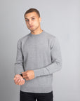 Model wearing The Merino Wool Sweater Grey Melange, front - Unborn