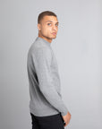 Model wearing The Merino Wool Sweater Grey Melange, black - Unborn