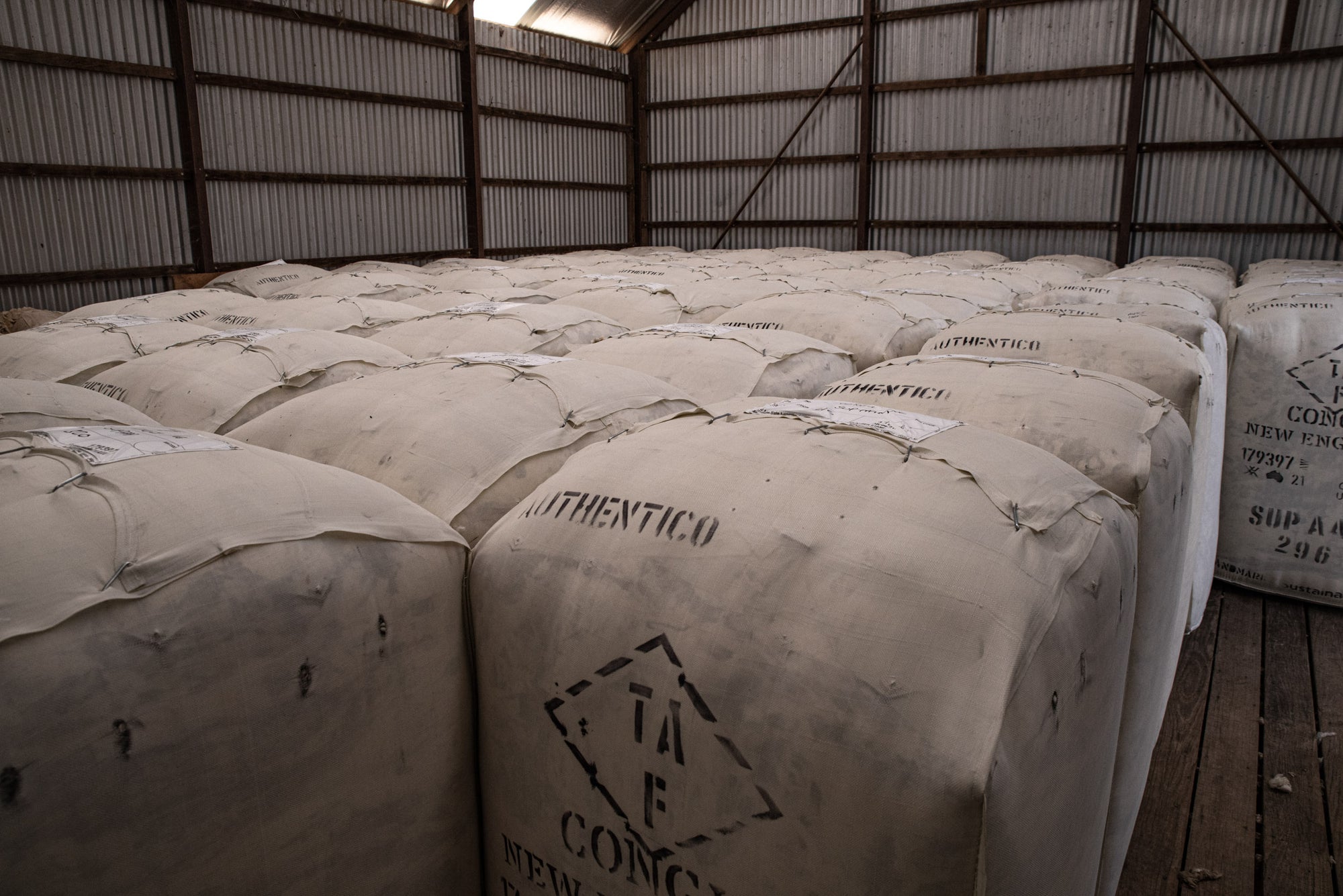 Packed, stamped and closed Merino wool bales stored in warehouse at Congi Station