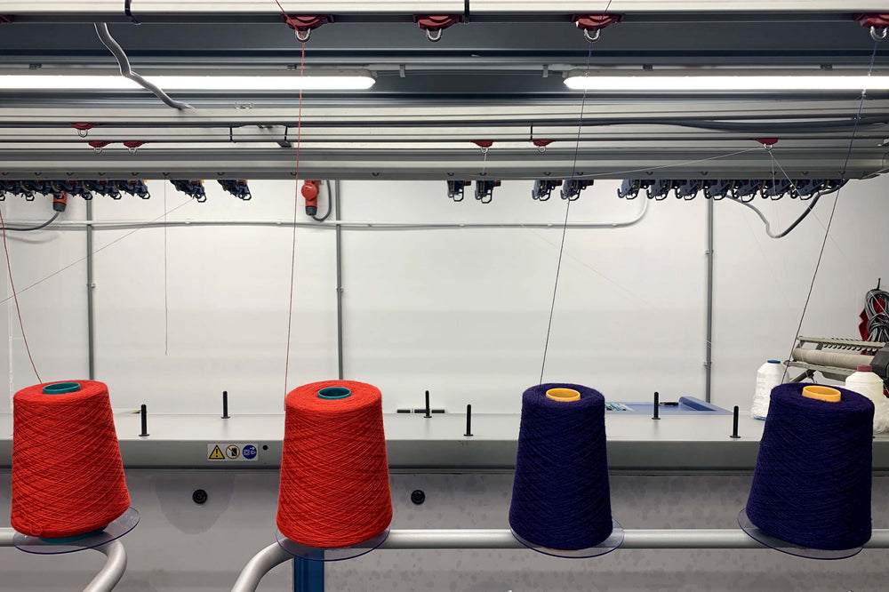 An industrial Stoll knitting machine at Knitwealab with cradle to cradle certified Arkaba Merino wool yarns