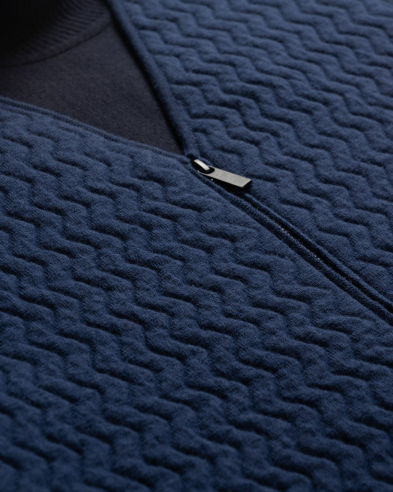 Close up of Merino d'Arles Padded vest fabric in medieval blue front view