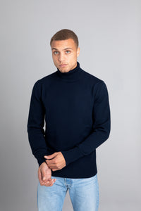 Model wearing The Merino Roll Neck Sweater Navy, front view - Unborn