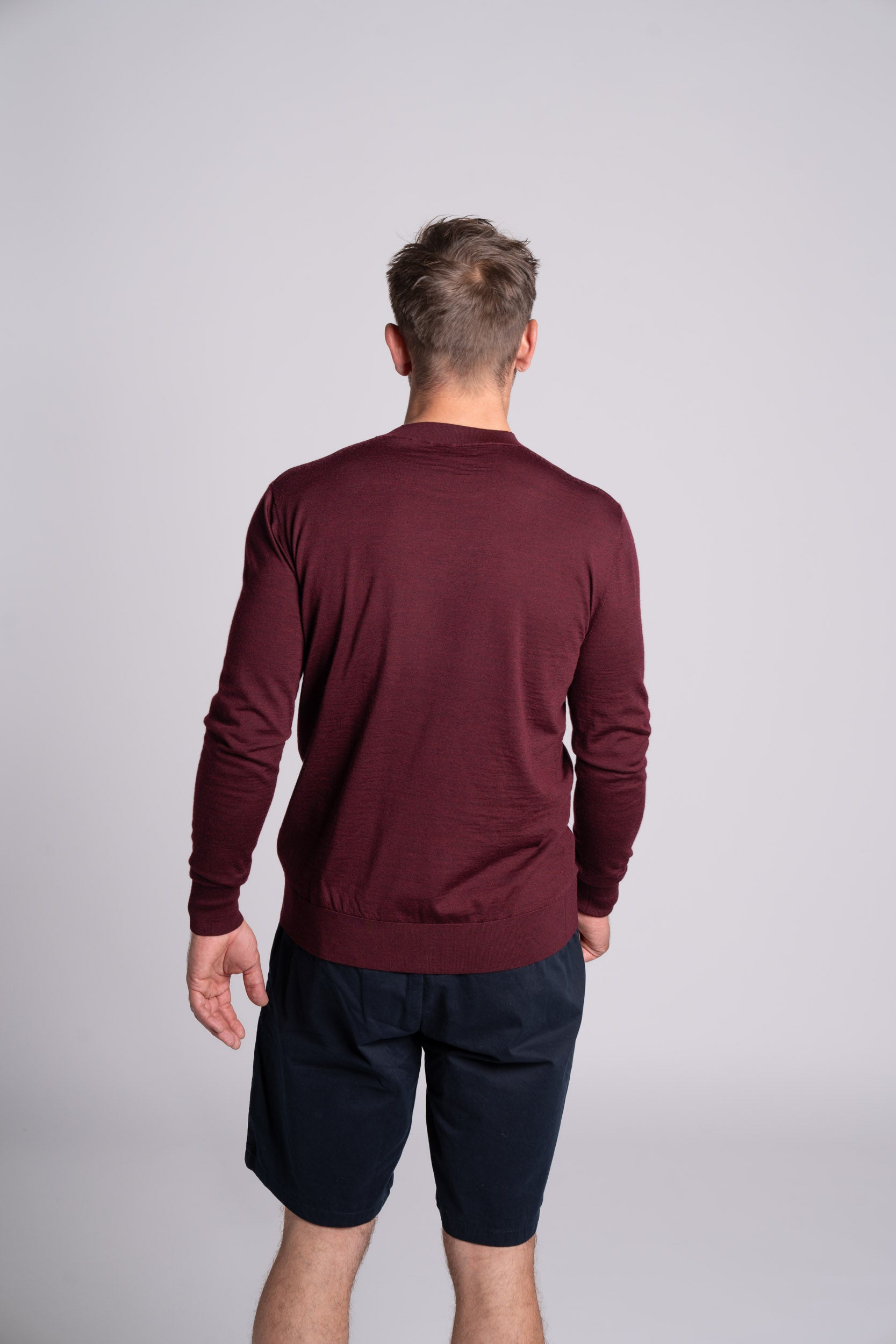 Model wearing Merino Featherweight Sweater Bourdeaux Back View
