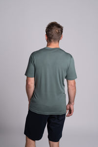 Model wearing Merino Featherweight T-shirt Moss Green Back