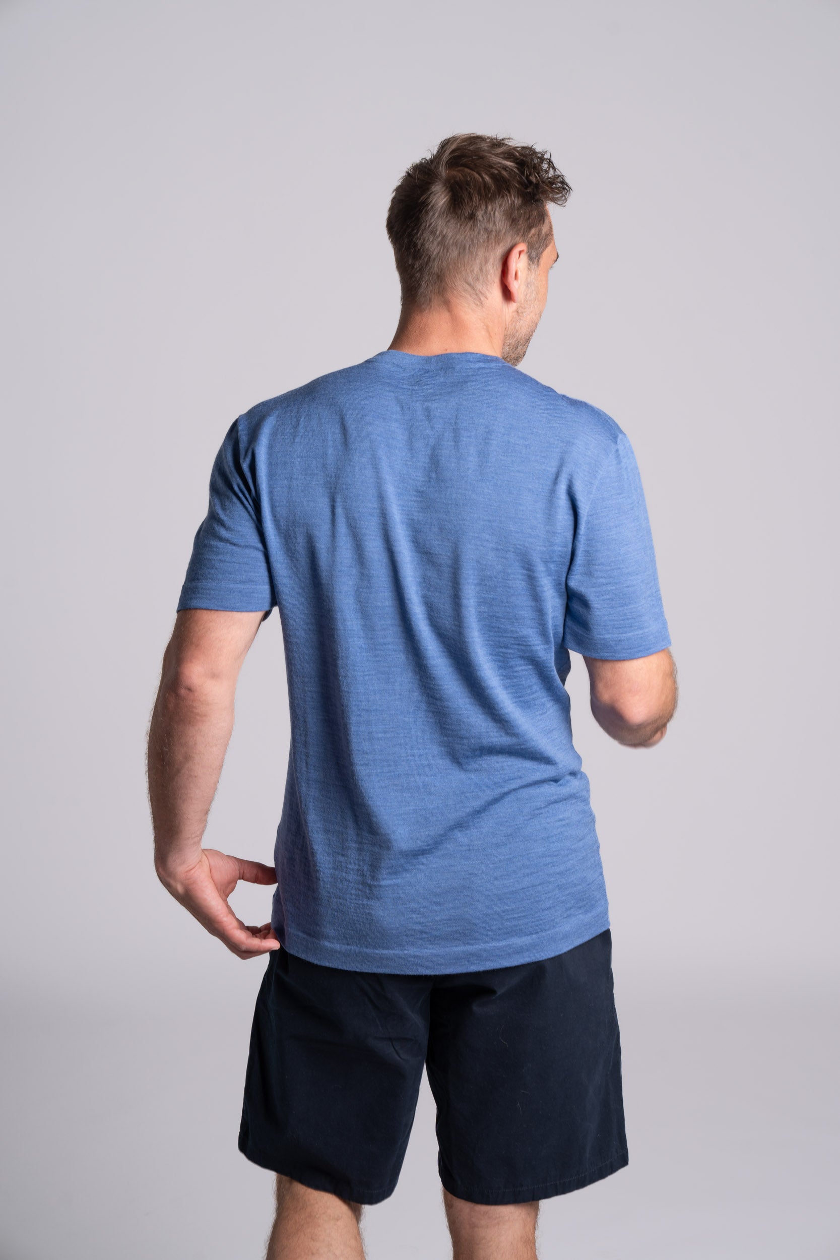 Model wearing Merino Featherweight T-shirt Sky Blue Back View