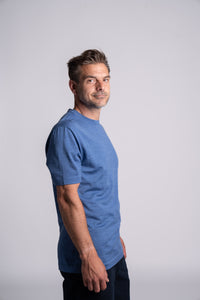 Model wearing Merino Featherweight T-shirt Sky Blue Side View