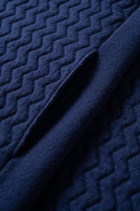 Close up with details of the pockets of the UNBORN Merino d'Arles Padded vest in medieval blue