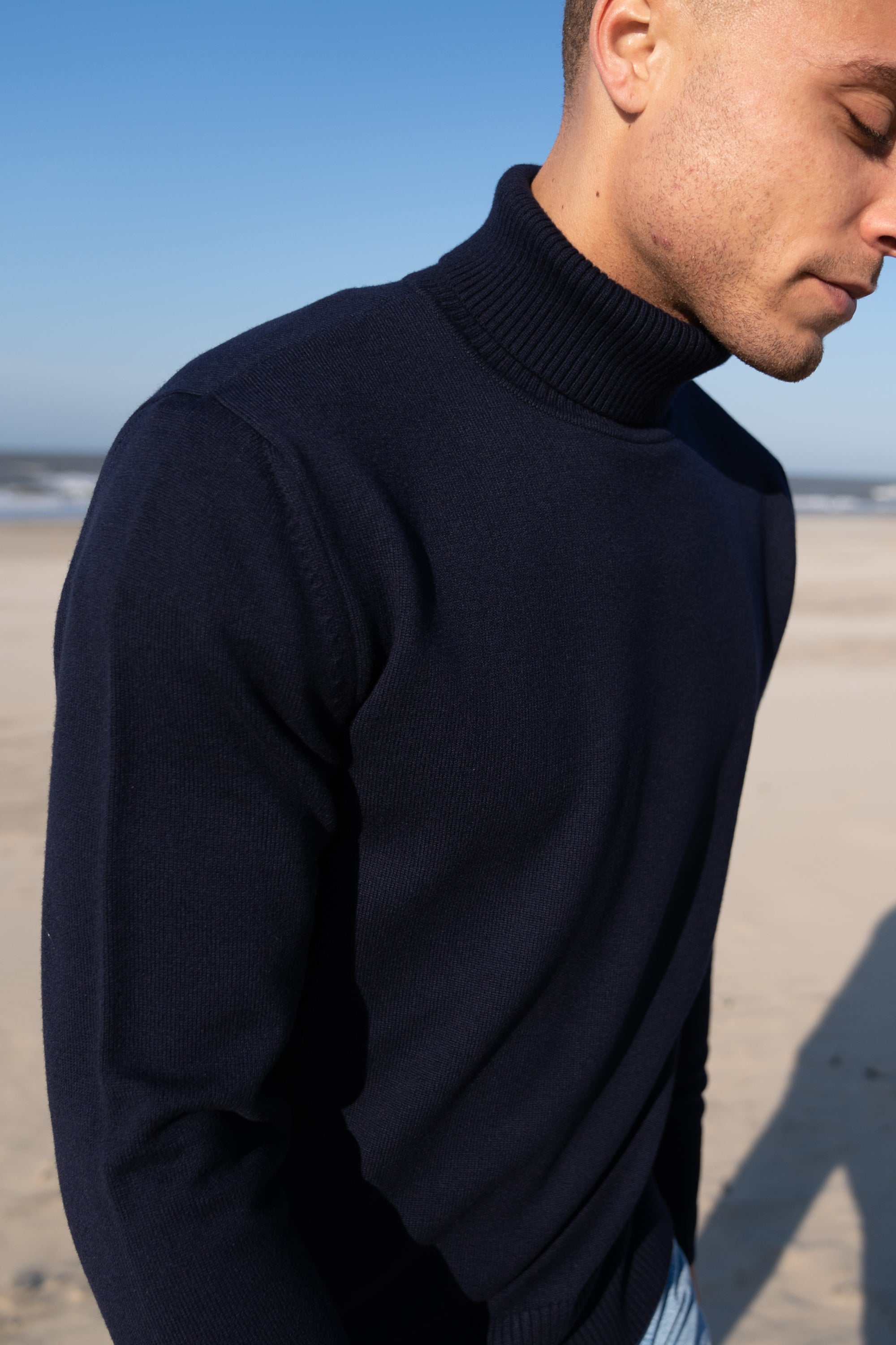 Model Wearing Heavy Merino Roll Neck Navy Beach