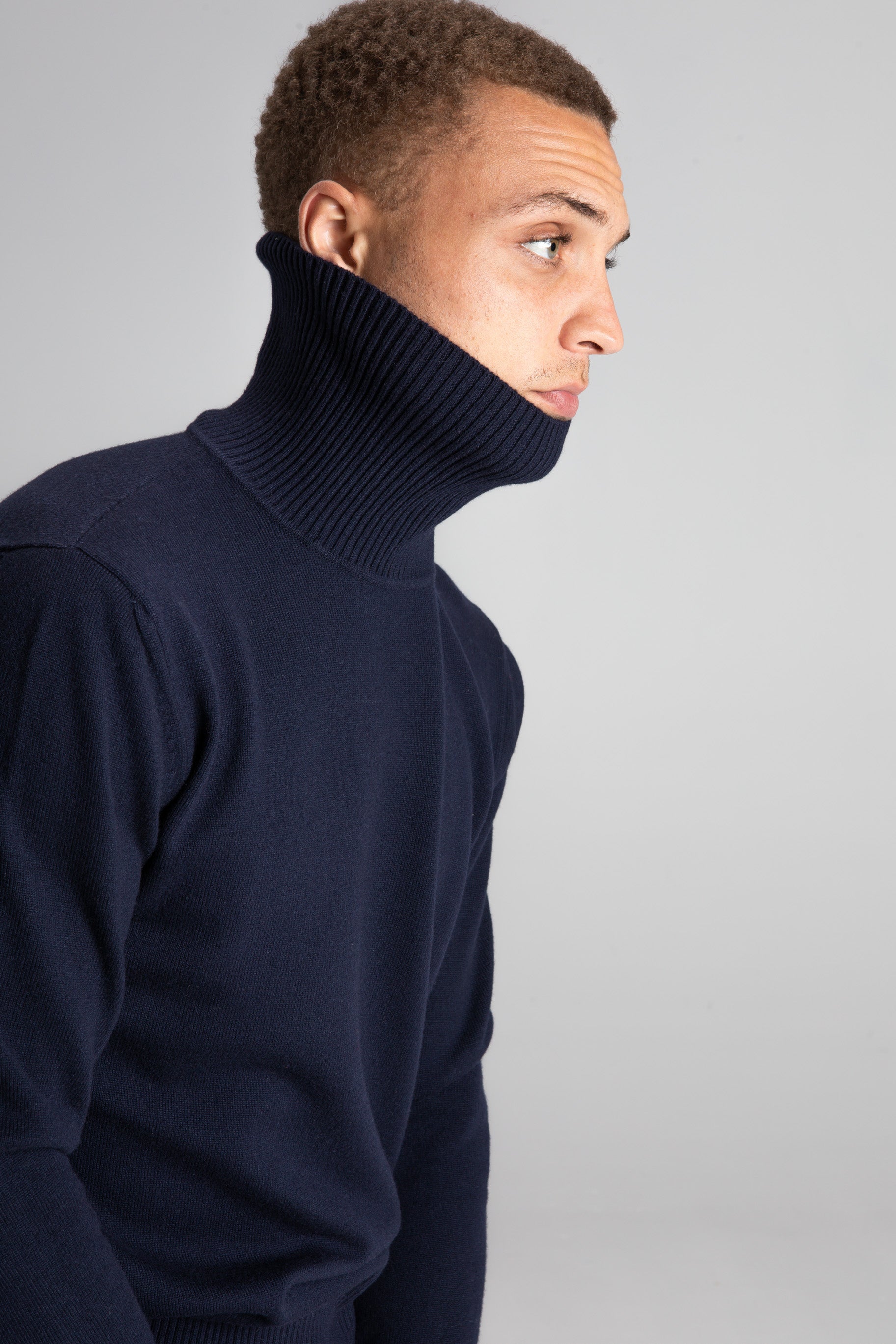 Model Wearing Merino RollNeck Navy Studio