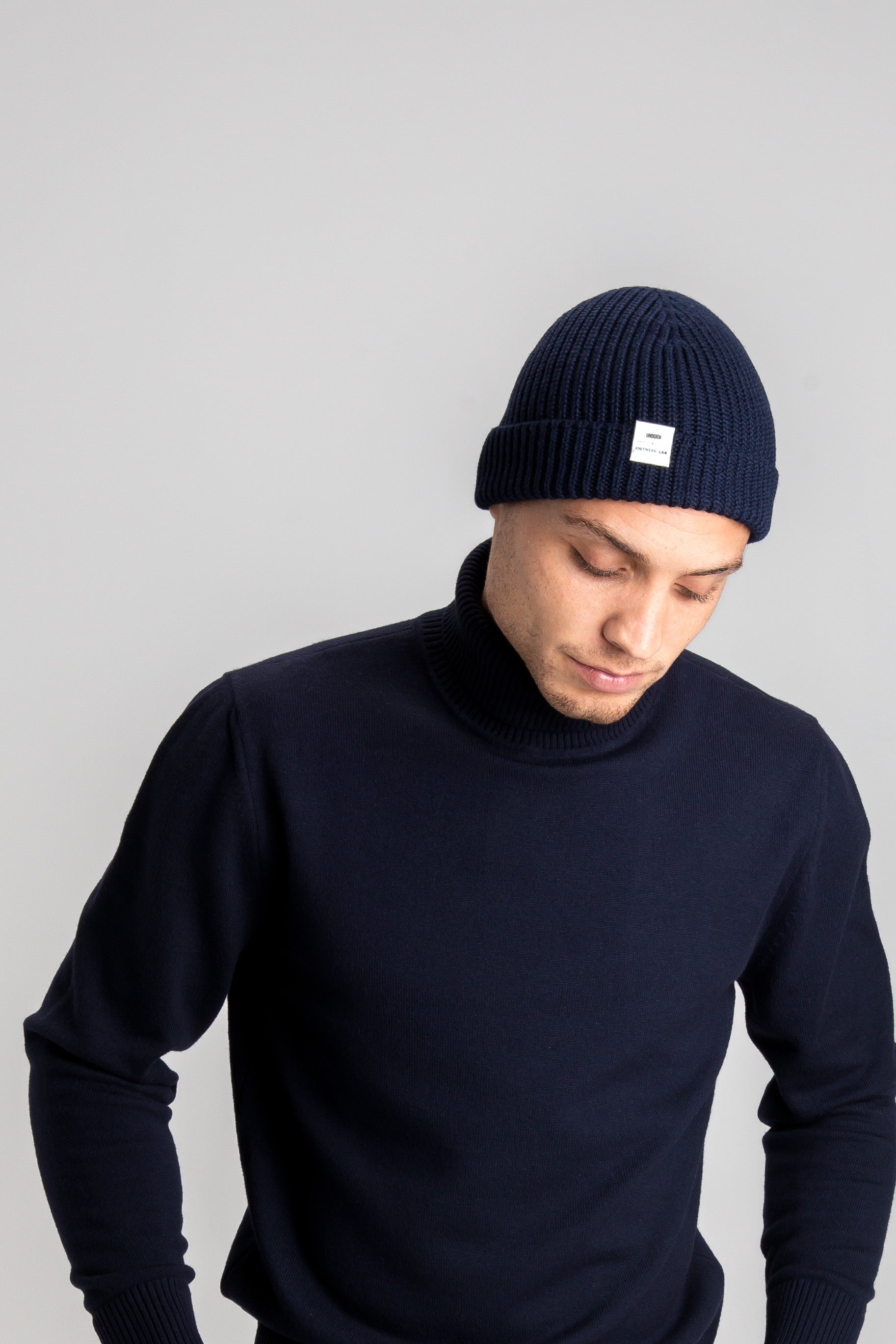 Model Wearing Light Merino RollNeck Navy Studio