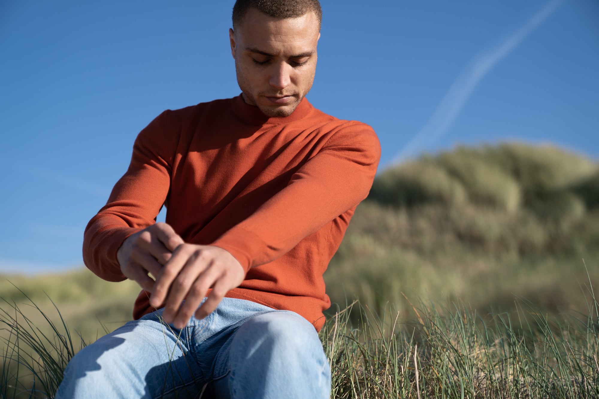 Model Wearing Light Merino Sweater Orange Beach