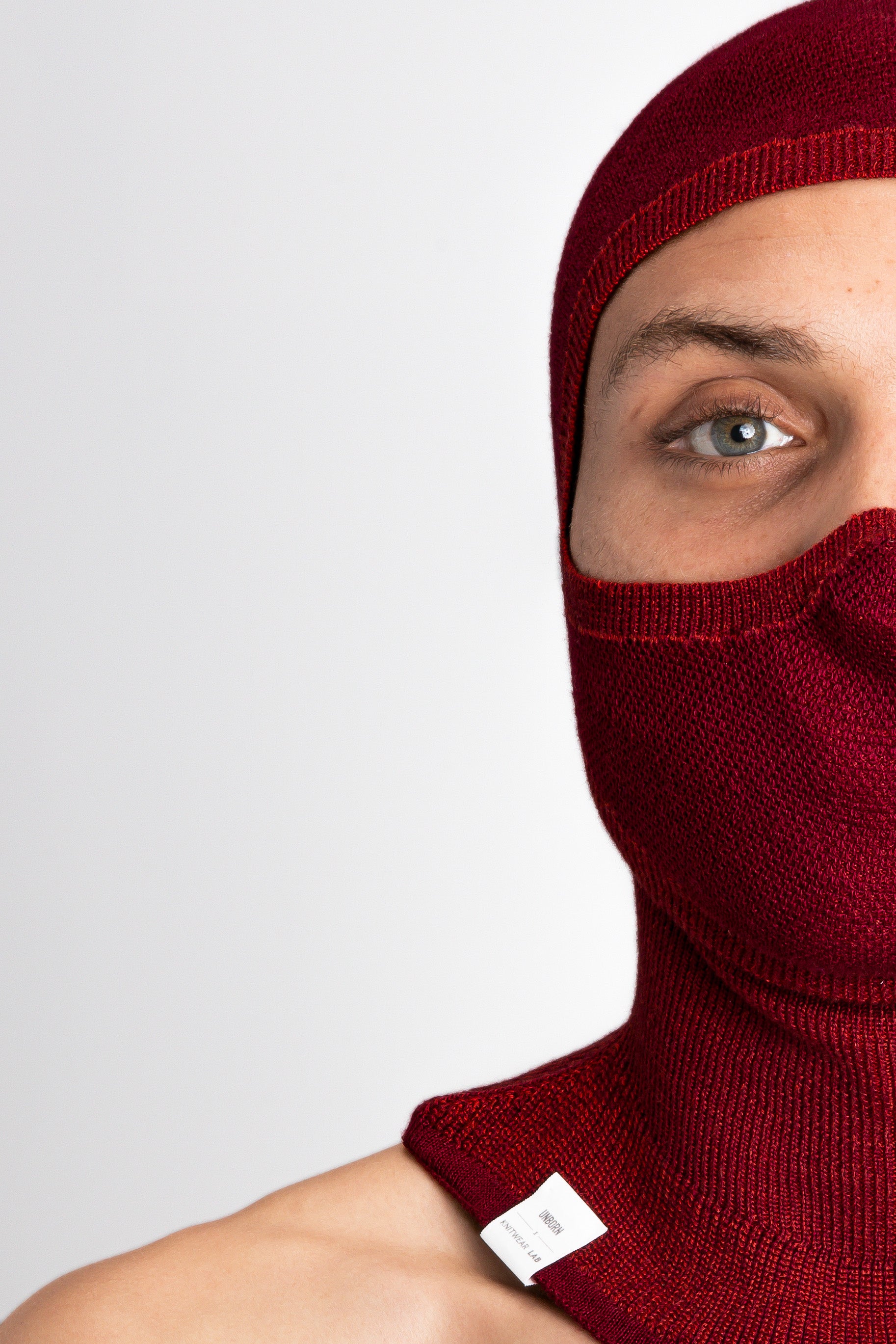 Model Wearing Merino Balaclava Brick Red Studio