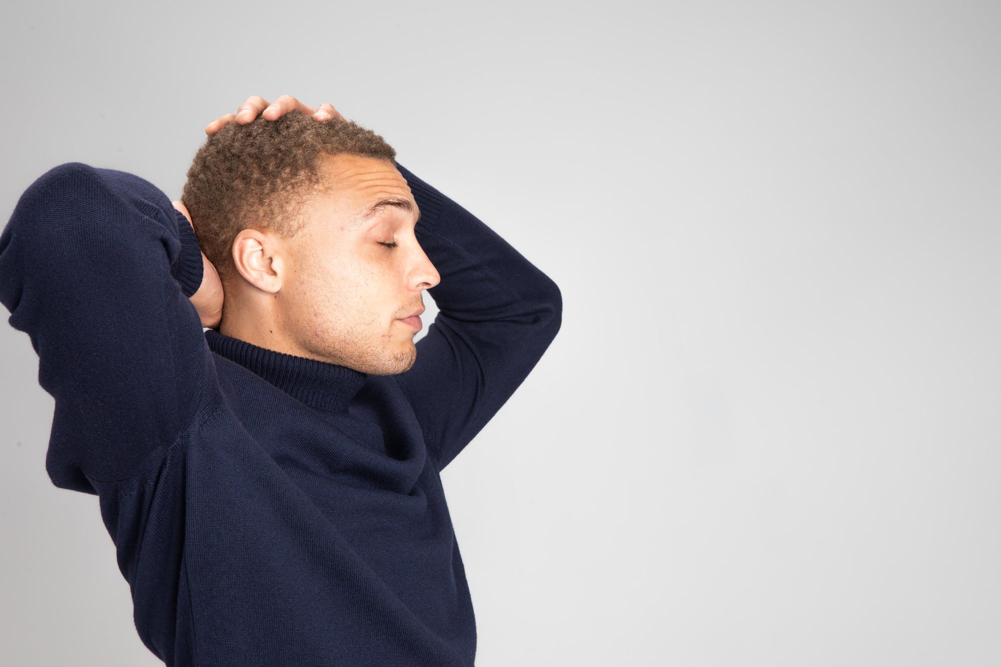 Model Wearing Merino RollNeck Navy Studio