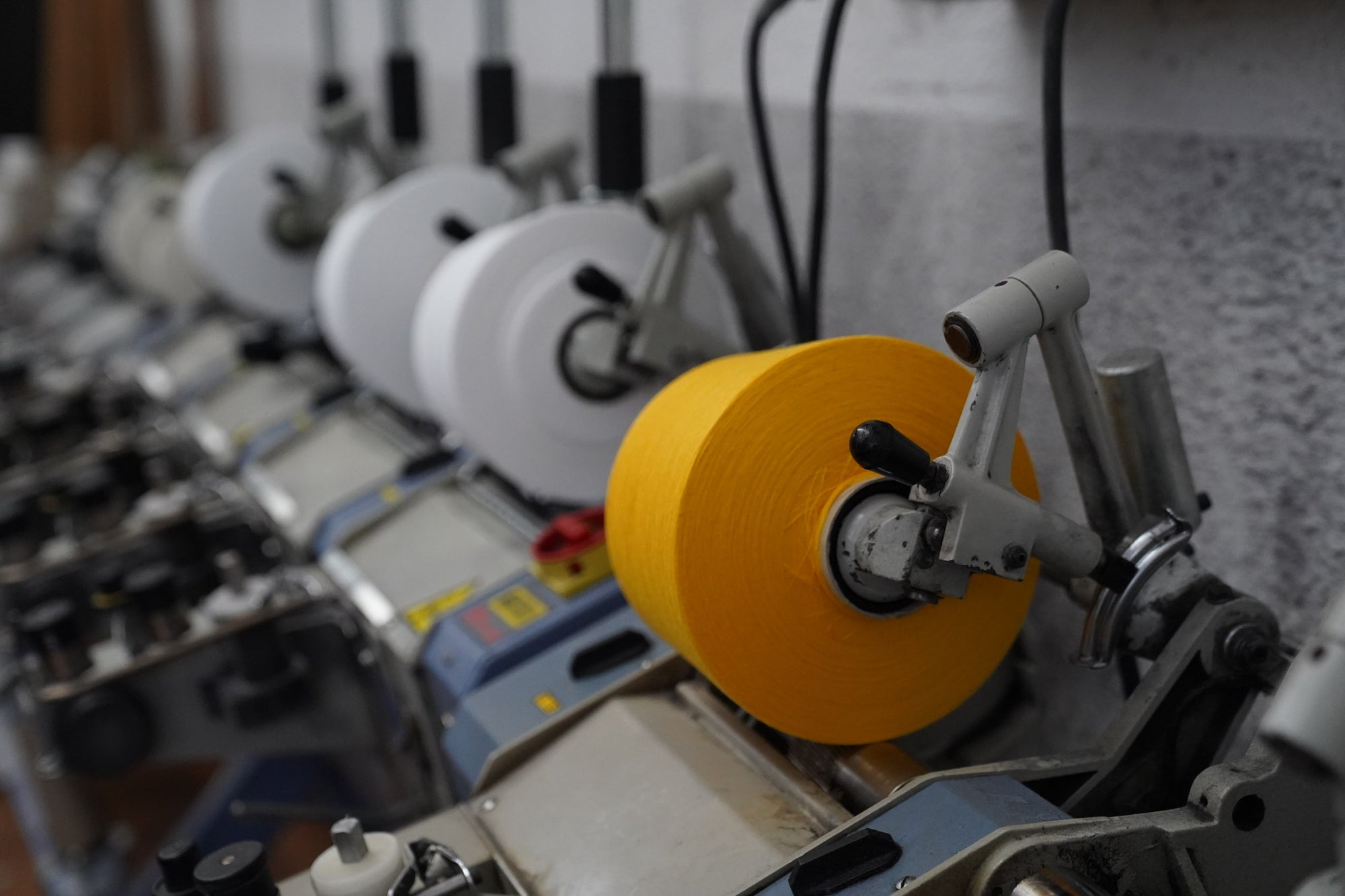 Yarn coning machine at Point Tricot