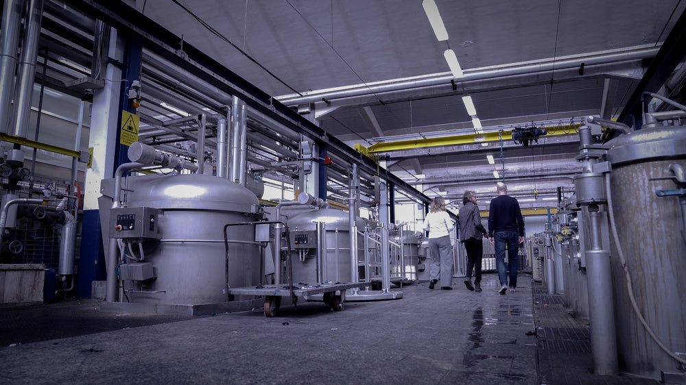 Group of large industrial dying kettles at dying facility in Valle Mosso