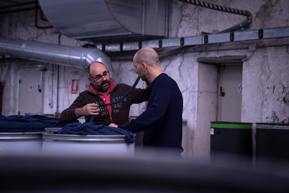 Facility manager of dyeing facility explaining the Cradle to Cradle dyeing process to founder of unborn