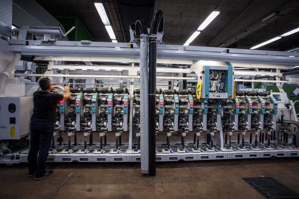 Production line of Merino wool coning machines at facility in Valle Mosso