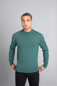 Model wearing The Merino Wool Sweater Light Foggy Green , front - Unborn